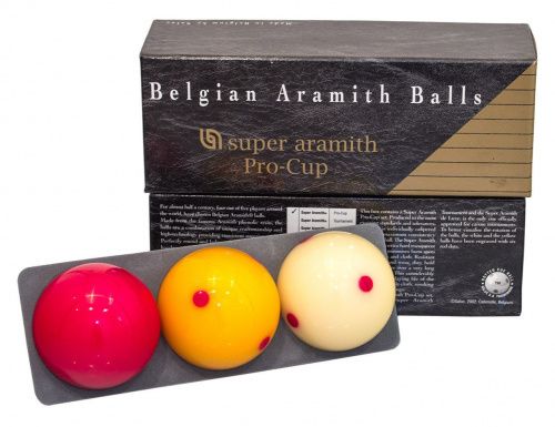 Three Pro-Cup billiard balls displayed on a gray holder.