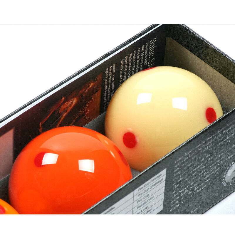 Overhead view of yellow and orange billiard balls in packaging