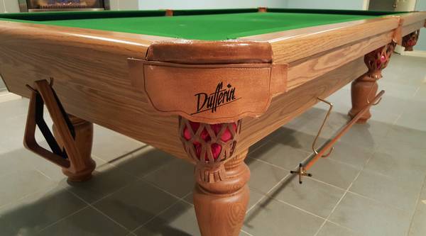Detailed corner view showing Dufferin logo and decorative carved leg detail