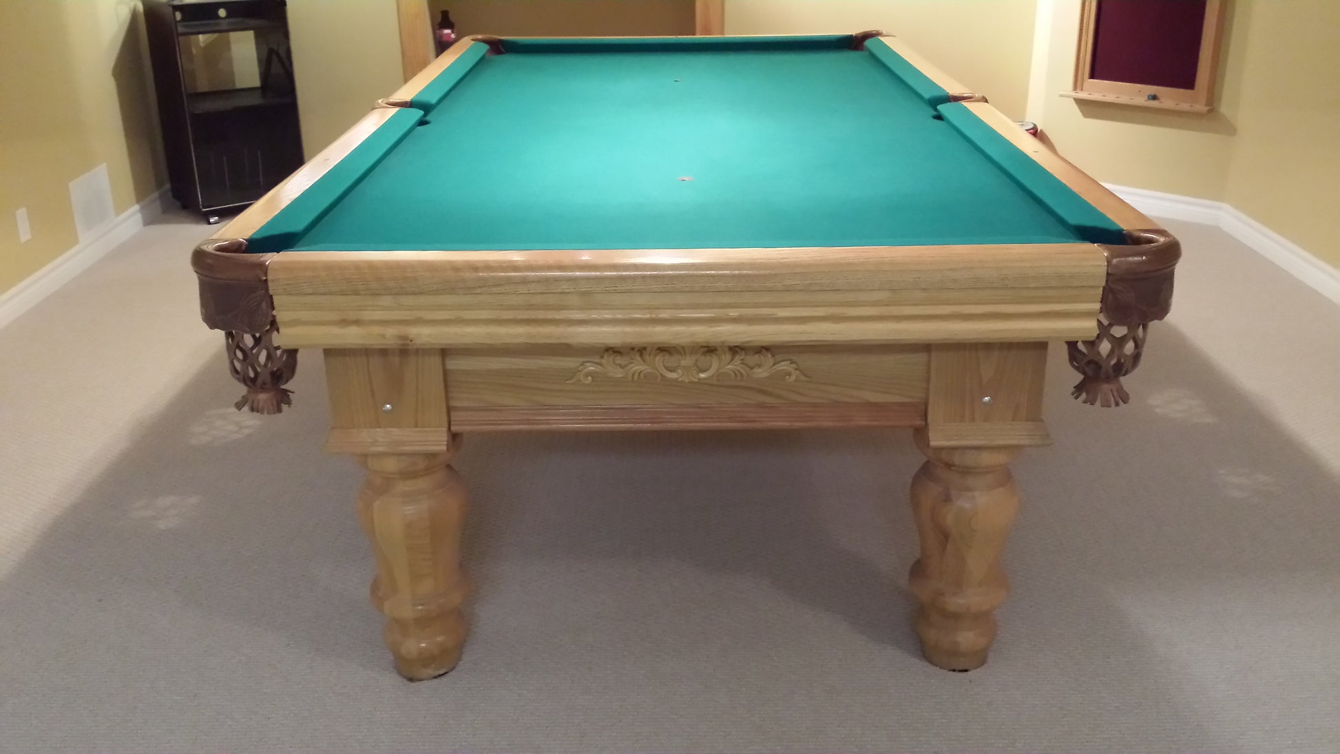 Full overhead view of billiard table with turquoise playing surface