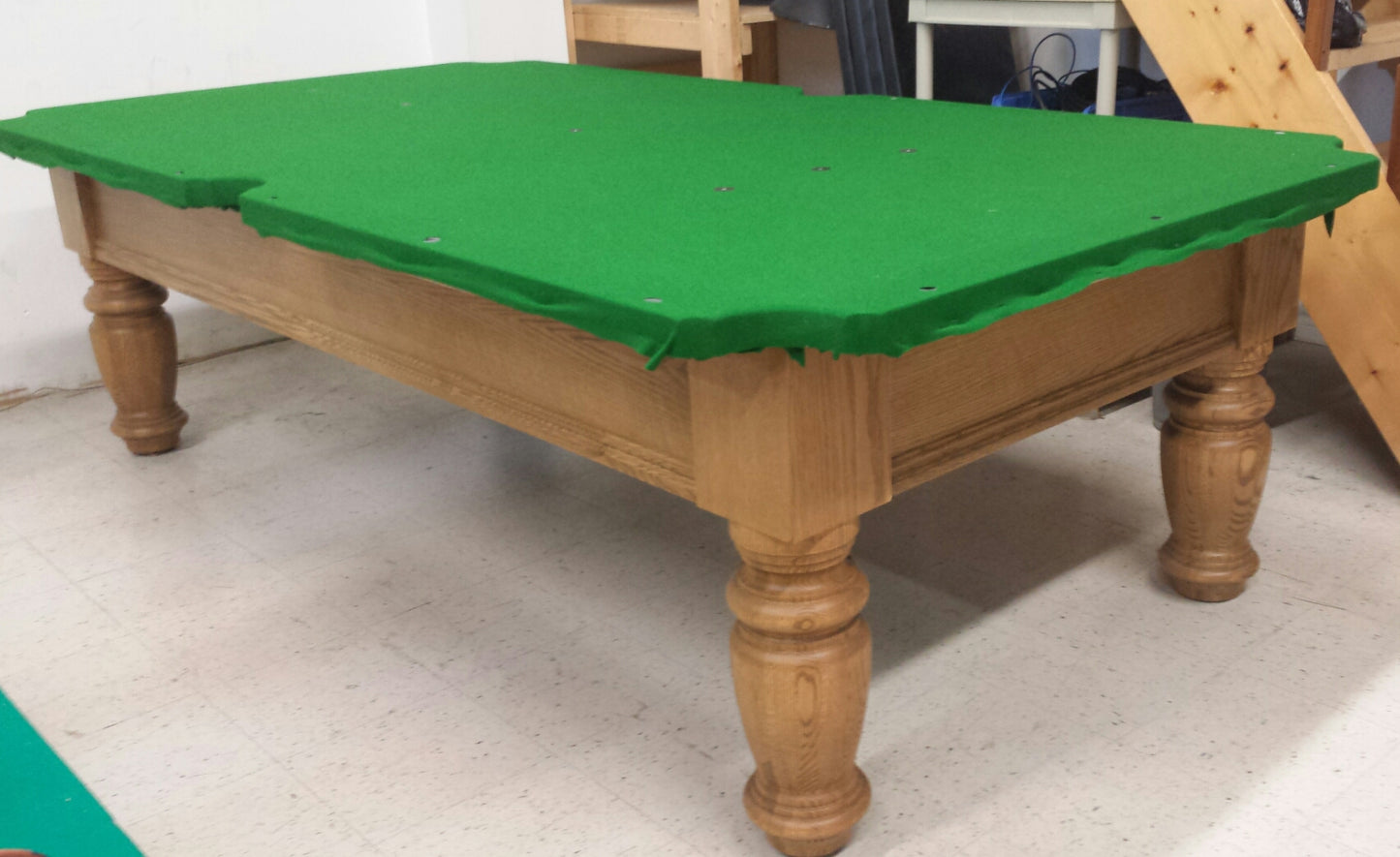 Angled overhead view of assembled table with felt installed
