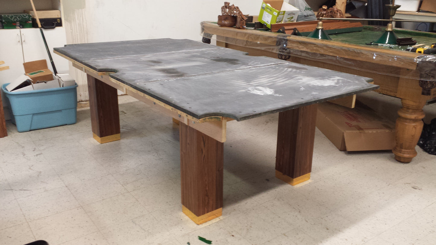 Slate playing surface covered with protective material