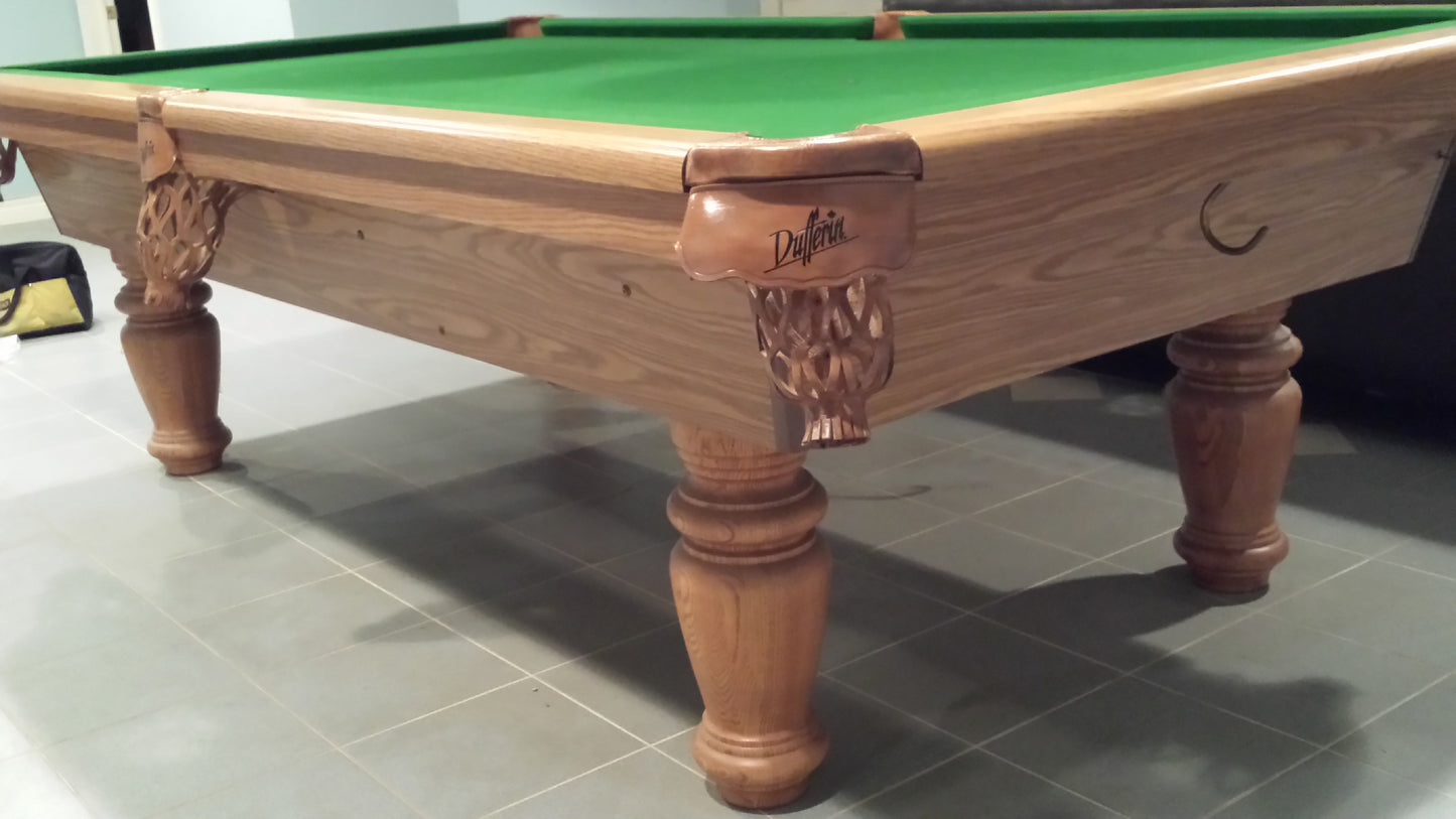 Low-angle view of ornamental leg carving and rail construction