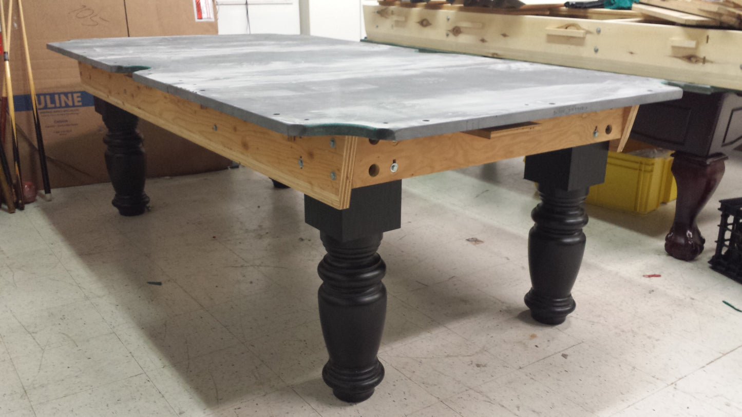 Protective covering on slate surface with wooden frame visible underneath