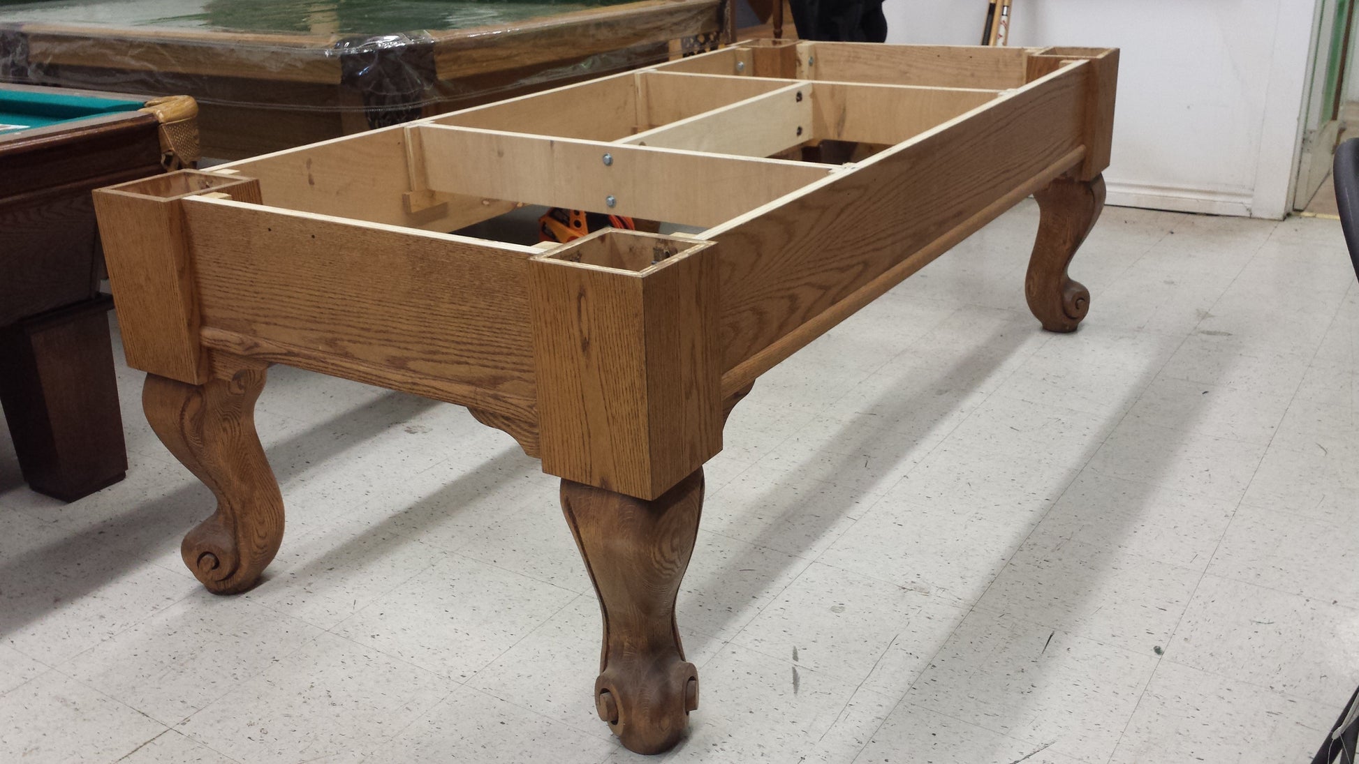 Interior view showing wooden slate bed and compartment structure without felt
