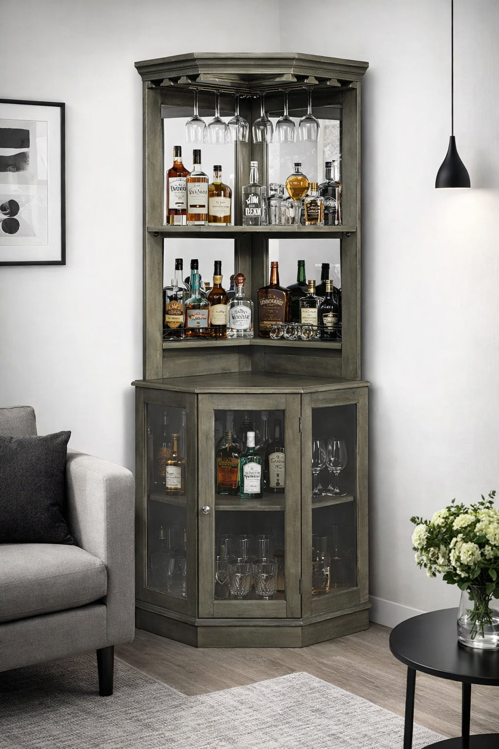 Fully stocked bar cabinet set up in a living area with furniture.