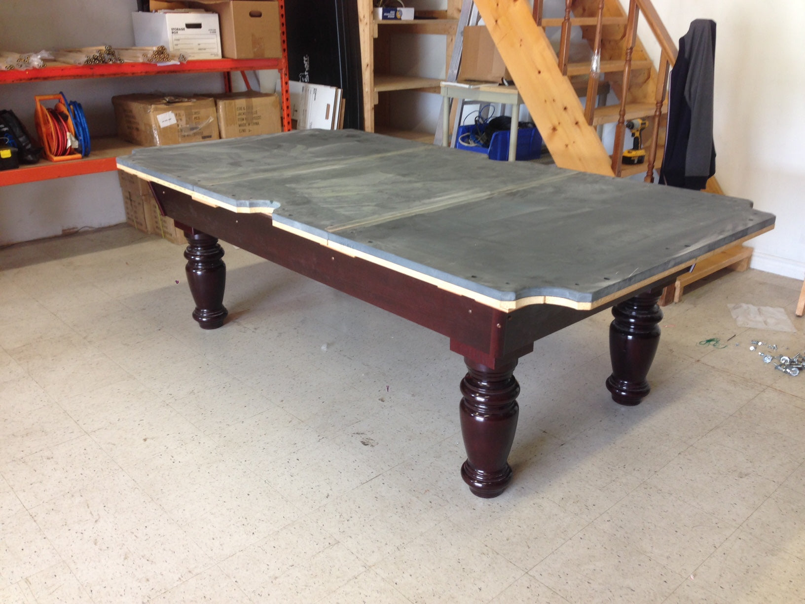 Side profile showing slate surface mounted on burgundy base structure