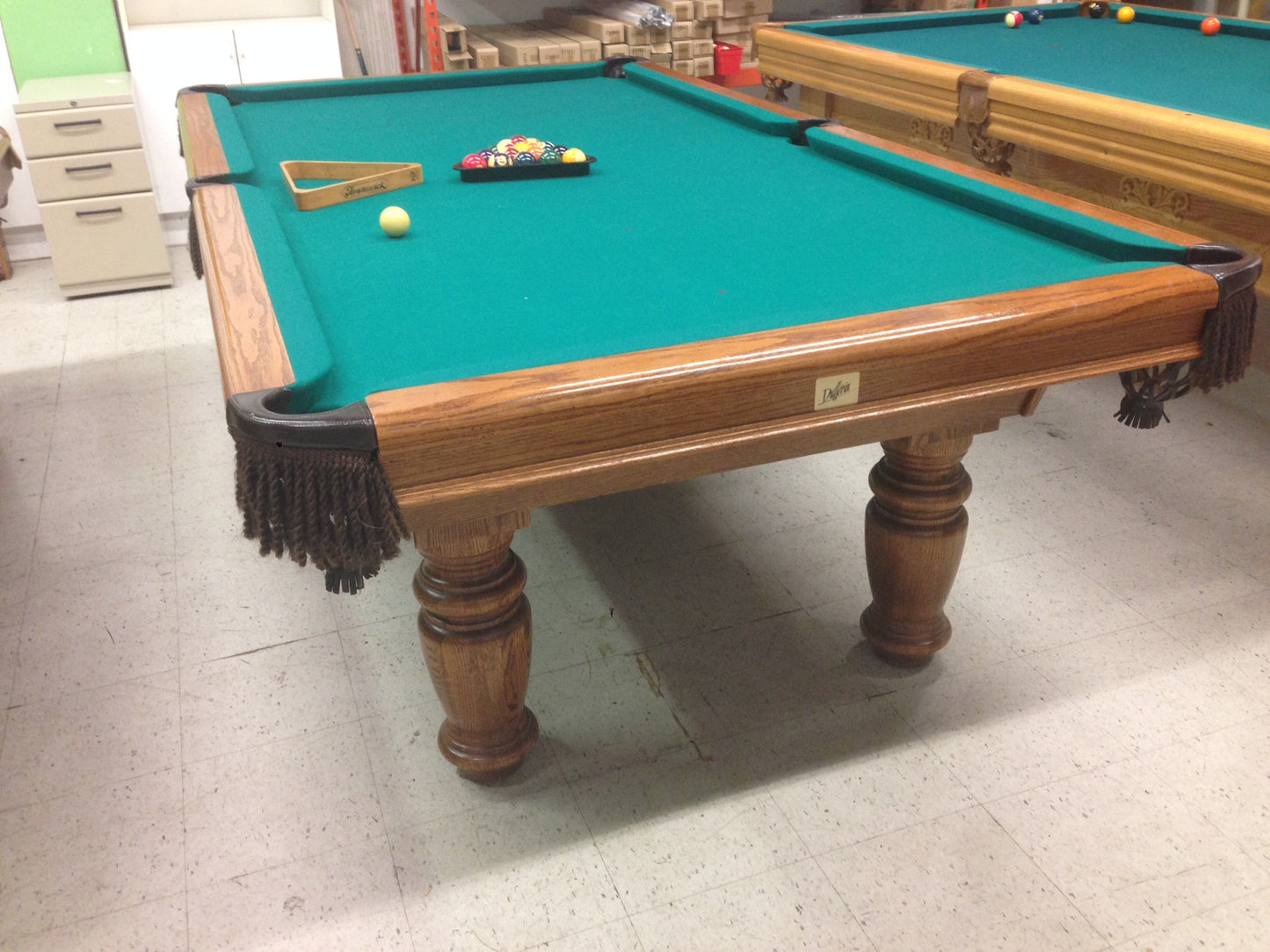 Overhead perspective of pool table with balls and accessories on felt