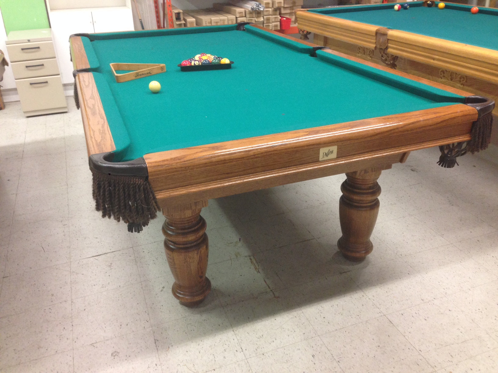 Overhead perspective of pool table with balls and accessories on felt