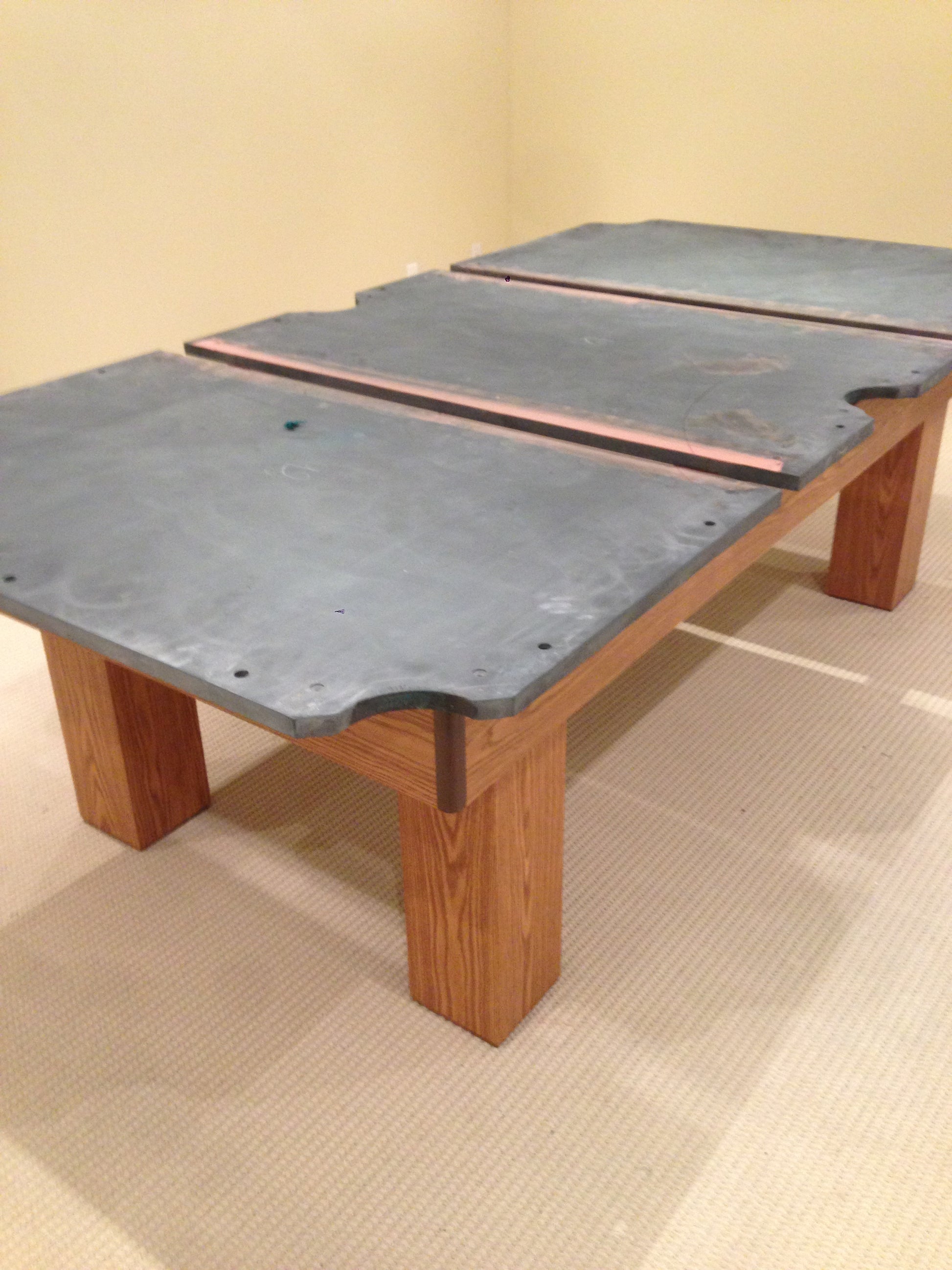 Unfinished table frame showing slate bed and internal frame rails