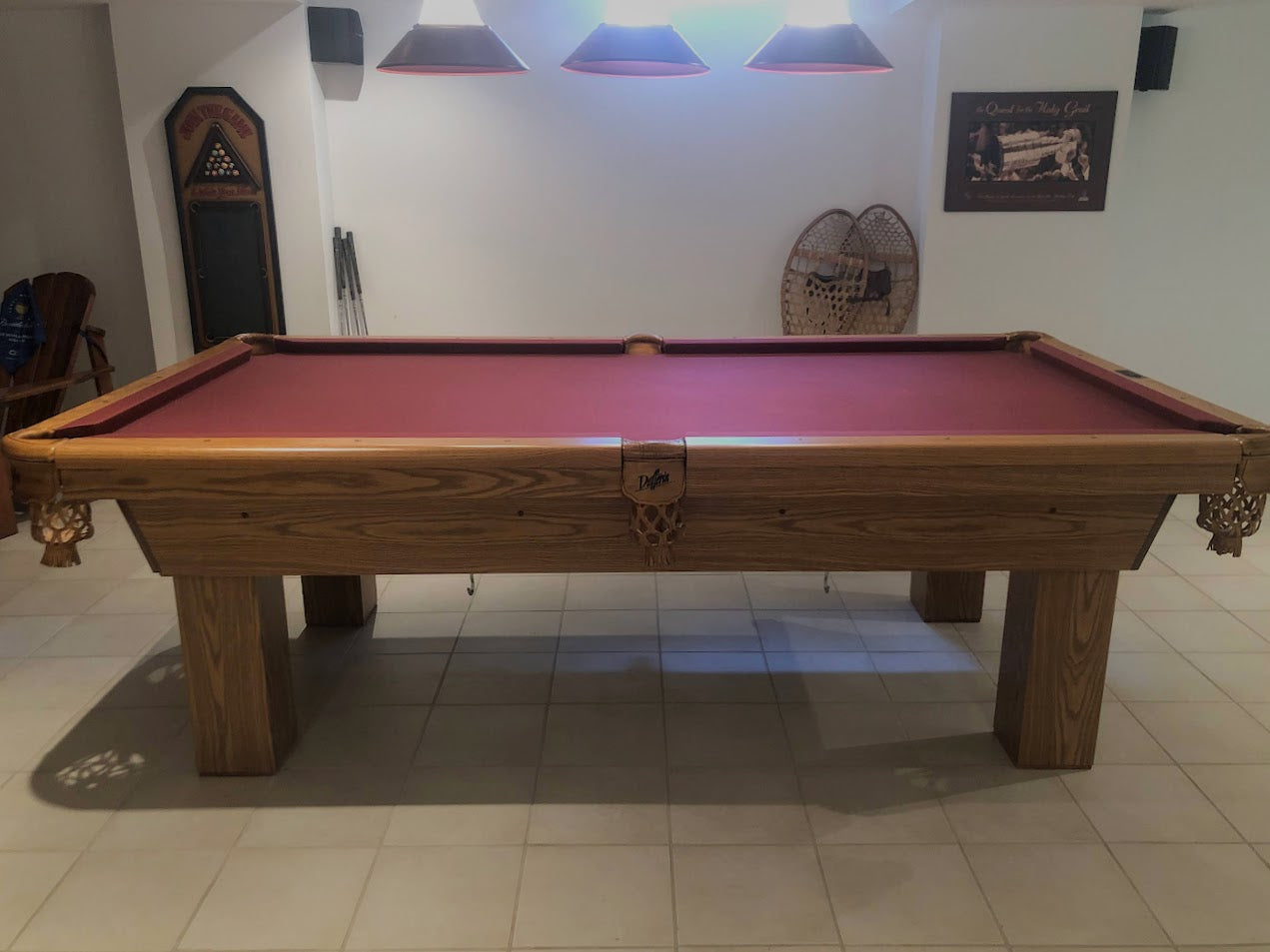 Full frontal view of pool table in bright indoor setting