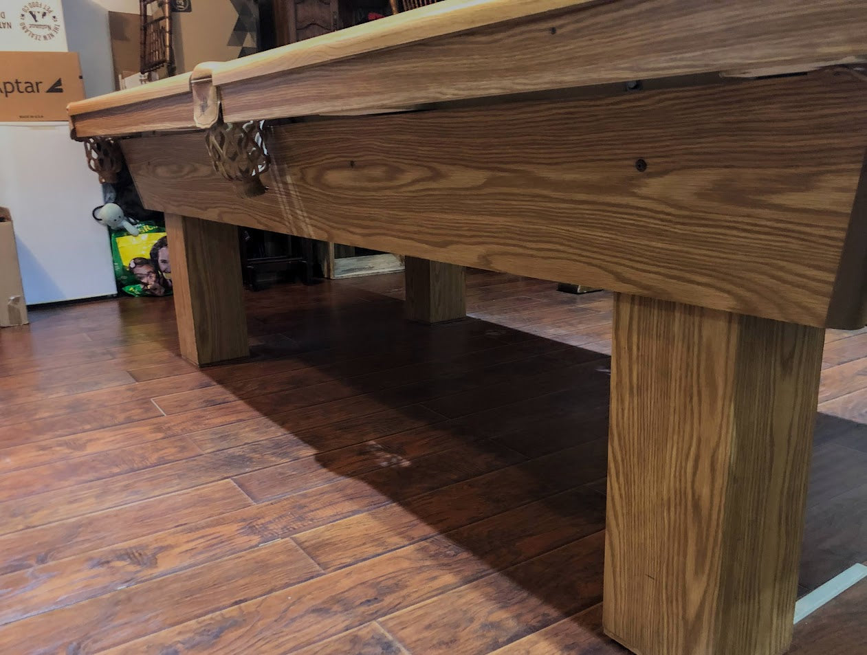 Profile view of table edge highlighting wood grain and construction