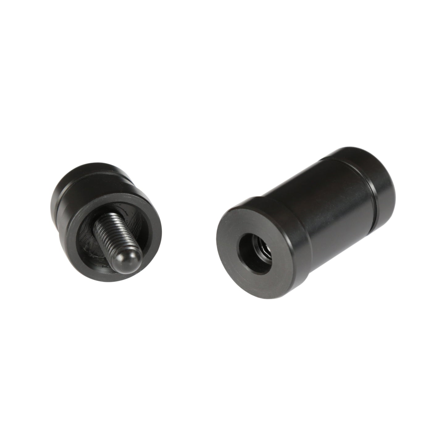 Two disassembled joint protectors for a billiard cue shown from an angle.