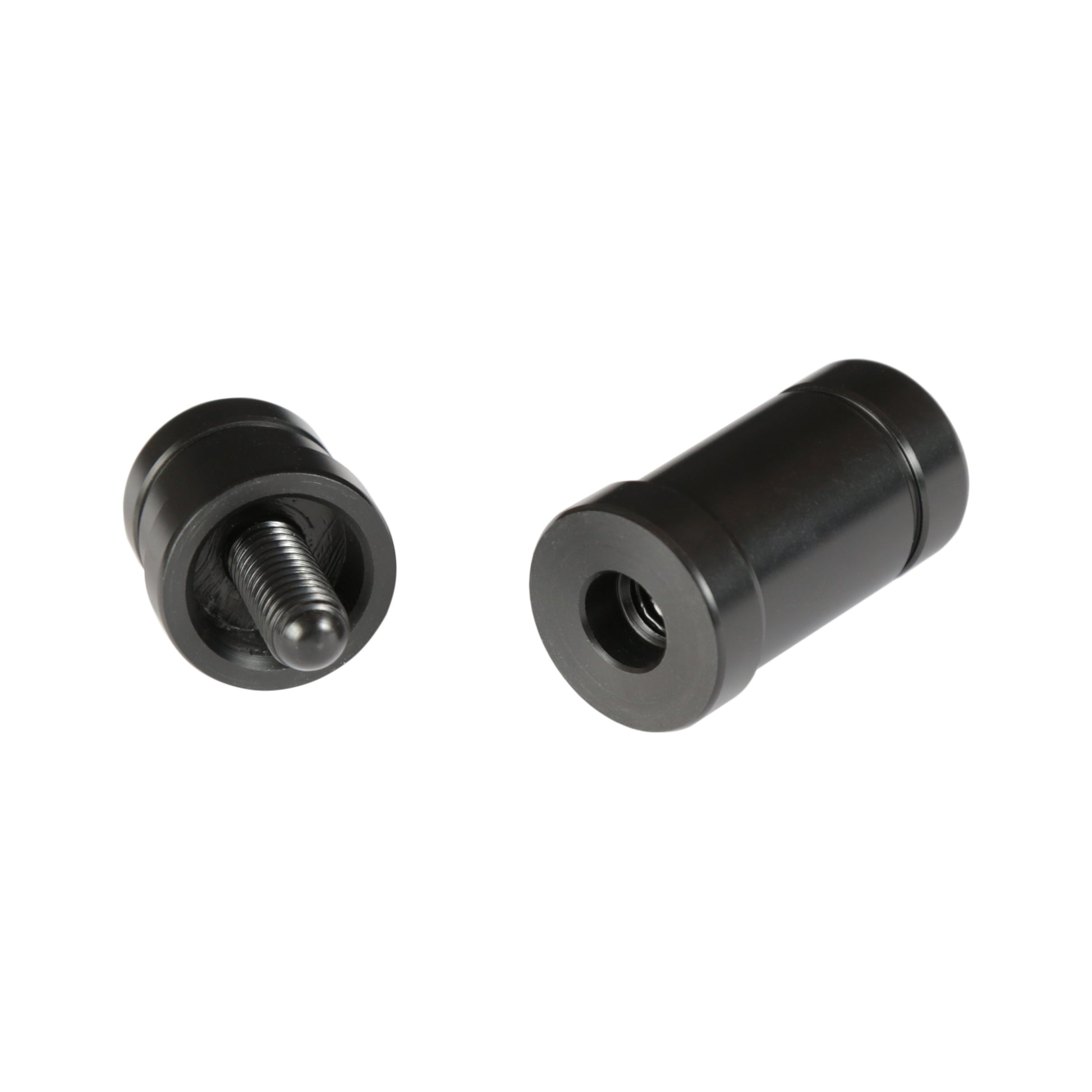 Two disassembled joint protectors for a billiard cue shown from an angle.