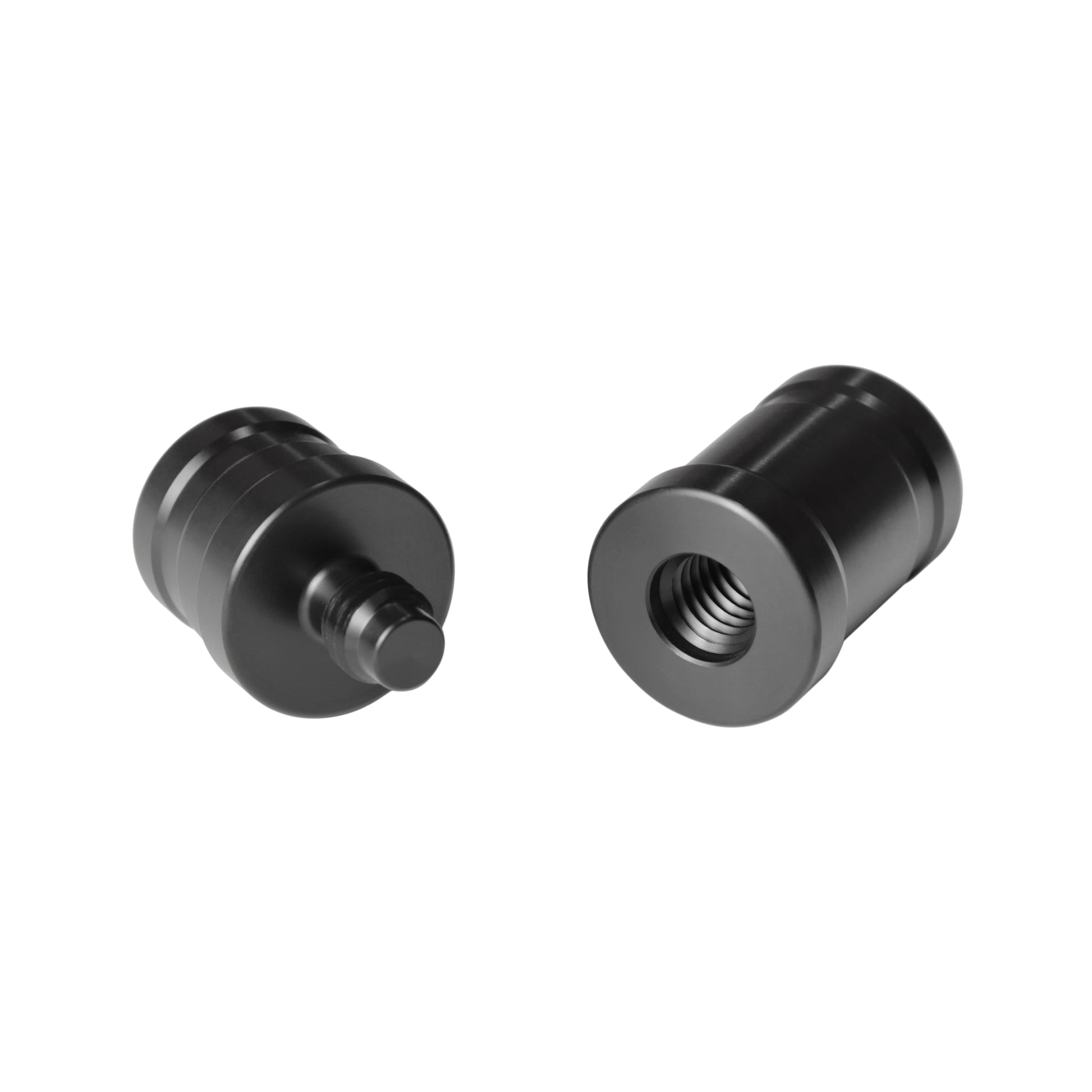Two black joint protectors, one with pin, one with thread.