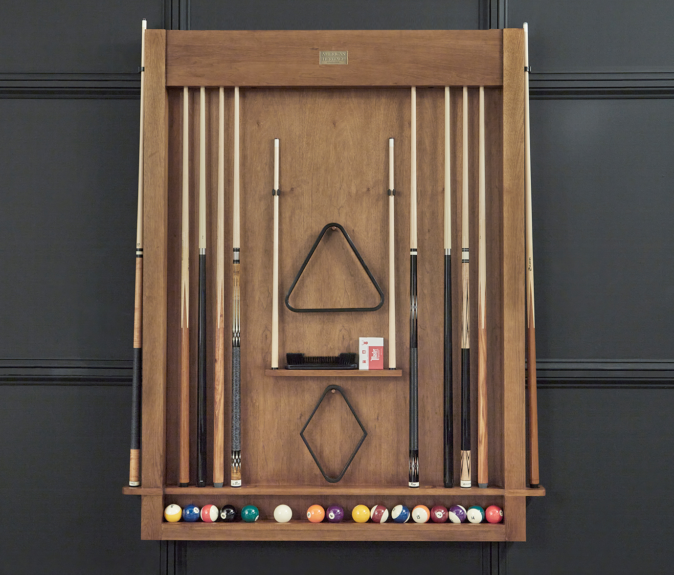 Interior front view with cues inserted, triangle and diamond holders, and ball tray installed