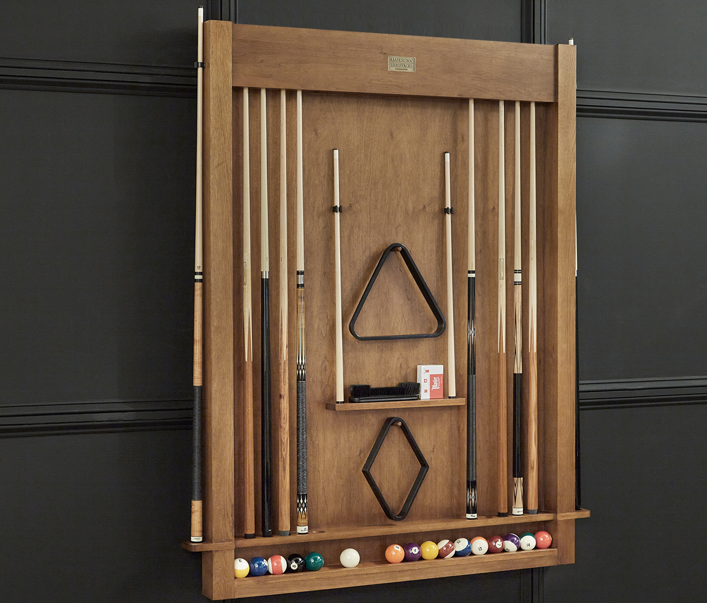 Open cue rack in home setting displaying billiard cues, accessories, and billiard ball collection