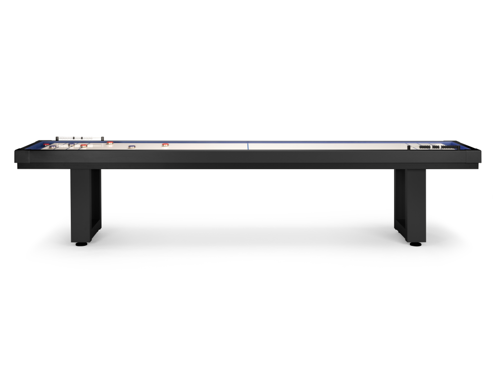 Long side view of shuffleboard table with puck and cue visible on surface