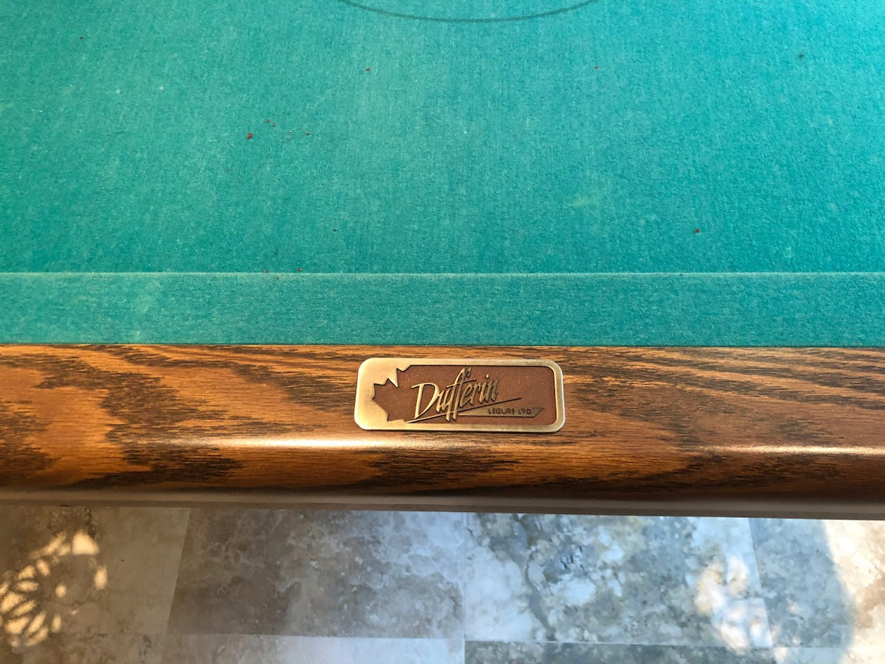 Rail engraving showing Dufferin brand nameplate on wooden edge